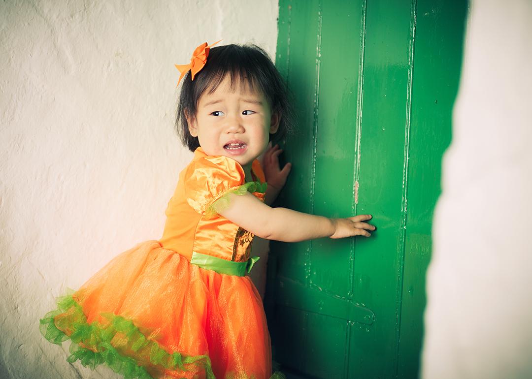 Child looking at Halloween decorations